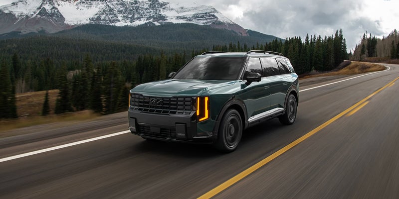 2027 Kia Telluride Hybrid driving on the highway